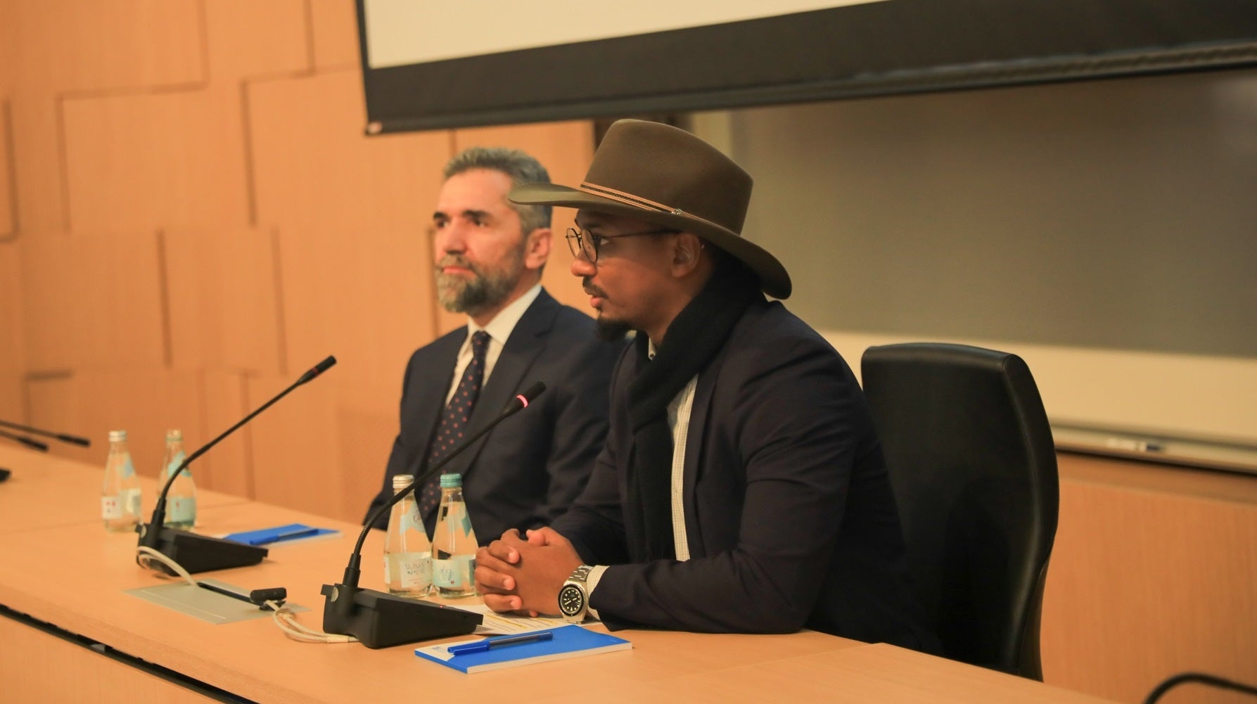 Sulaiman Bah, Community Engagement & Outreach Coordinator, Minaratein Center, and Dr. Recep Şentürk, Dean, HBKU’s CIS, welcome attendees to the launch of Al-Imān Amānah
