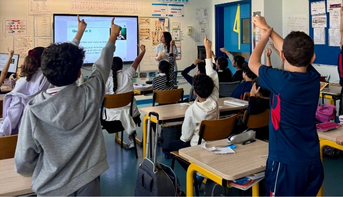 Participants at HBKU booth