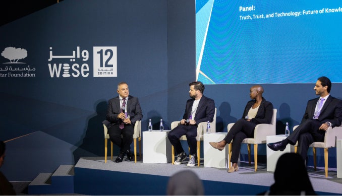 Hon. Dawda A. Jallow receives a gift from the Dean, College of Law