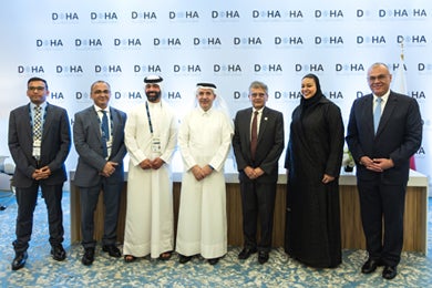 Dr. Ahmad M. Hasnah with HBKU staff after the signing.