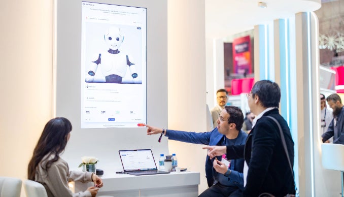 Participants attend a presentation by HBKU during the Summit.