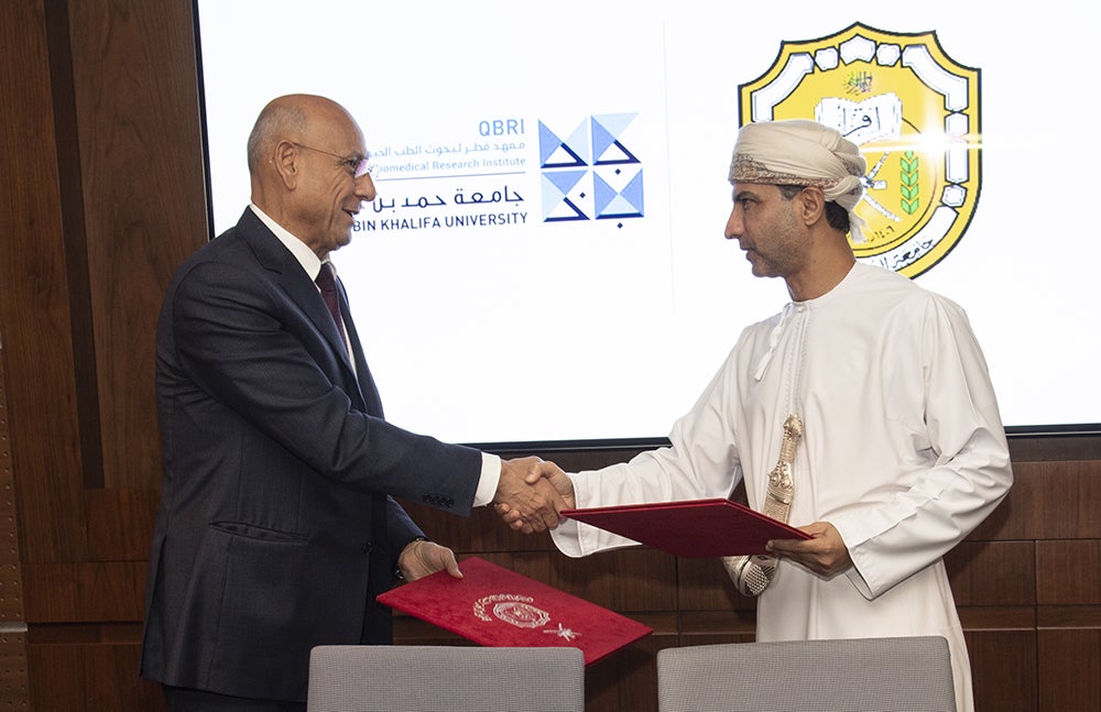 Dr. Omar El-Agnaf, executive director of Qatar Biomedical Research Institute, part of Hamad Bin Khalifa University, and Dr. Khalid Alrasadi, director of the Medical Research Center at Sultan Qaboos University, at the signing.