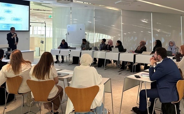 Professor Edoardo Obgaro highlights how religion shapes the functioning and management of public administrative systems to attendees.