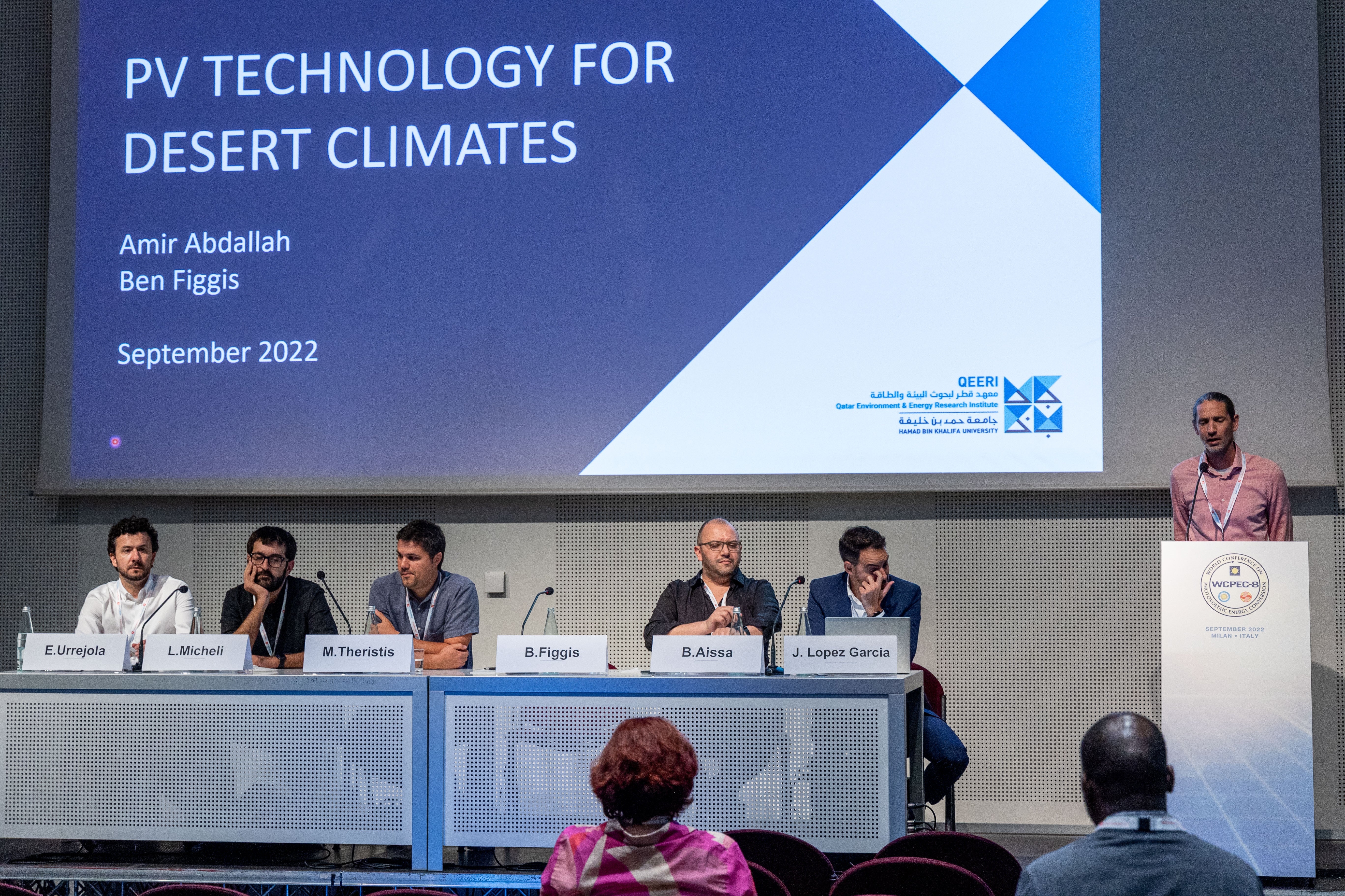 The conference’s happening at Milan in Italy, (2) Crowds come together at the QEERI display center, (3) A special peek into QEERI’s conference participation in Italy, (4) Dr. Marc Vermeersch speaking at the event