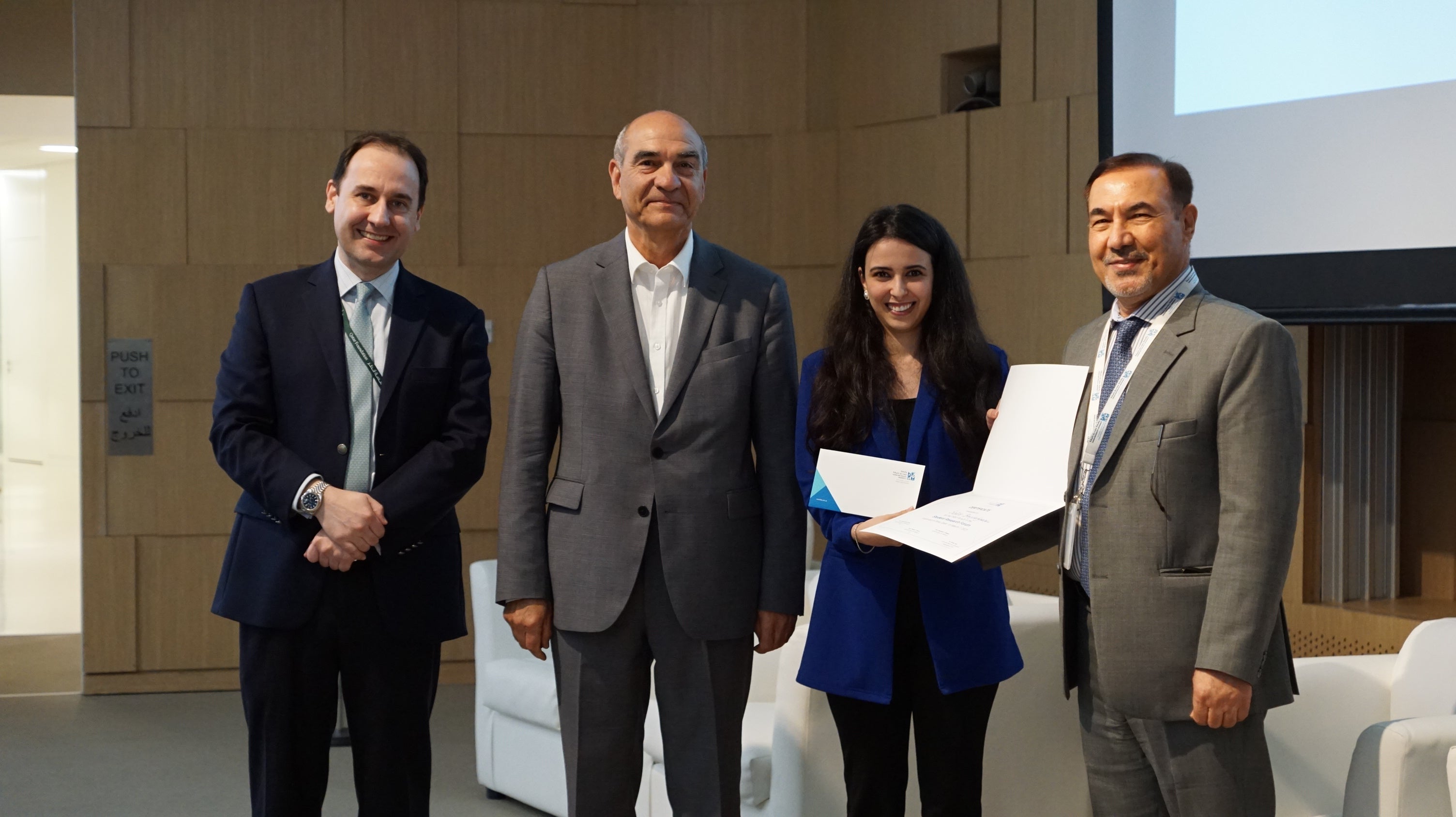 Safae Bouyahyaoui, MA in Intercultural Communication (second from right), receives the first place award from HBKU CHSS faculty.