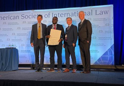 Professor Damilola Olawuyi, SAN, receiving the American Society of Law’s Certificate of Merit for High Technical Craftsmanship and Utility to Practicing Lawyers and Scholars for his book, “Environmental Law and Arab States.”