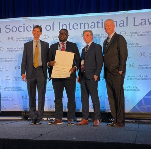 Professor Damilola Olawuyi, SAN, receiving the American Society of Law’s Certificate of Merit for High Technical Craftsmanship and Utility to Practicing Lawyers and Scholars for his book, “Environmental Law and Arab States.”
